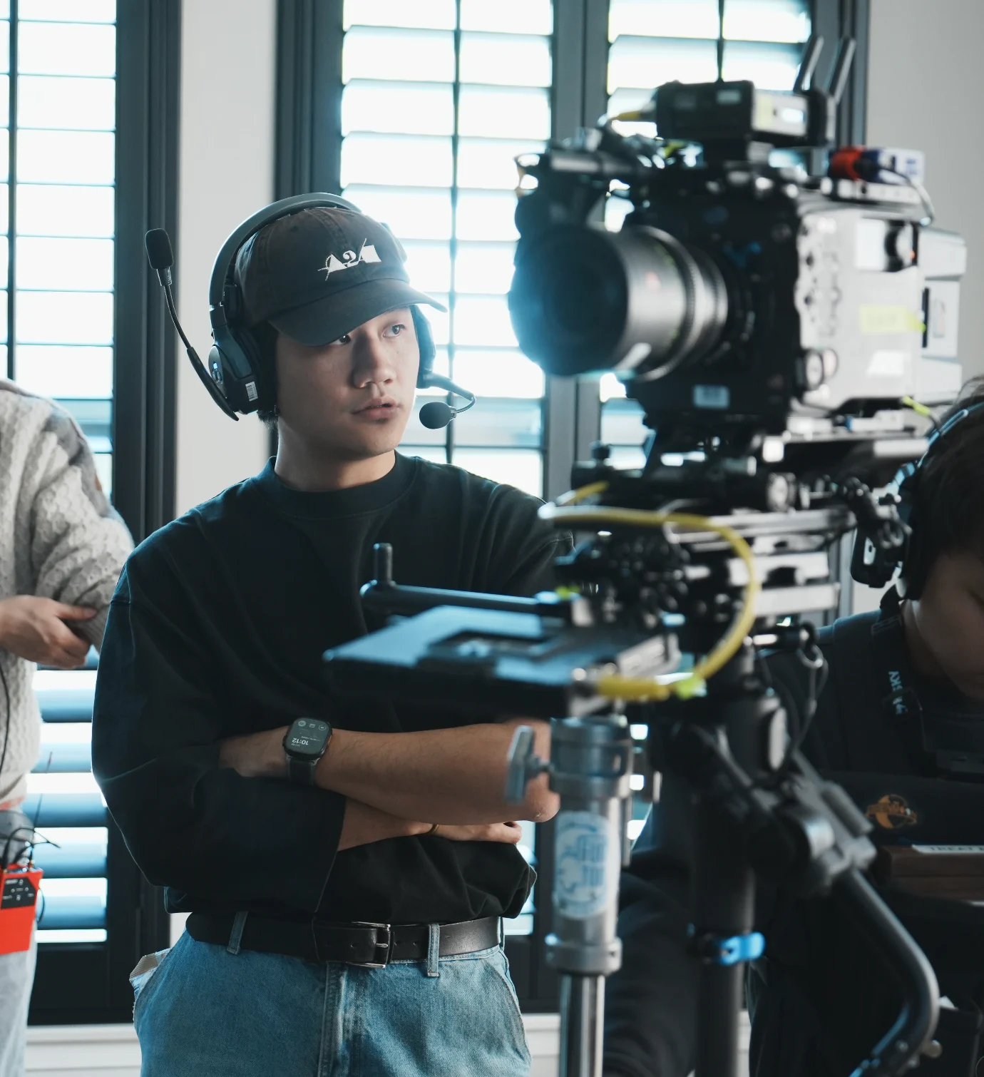 Joe Tu working beside an ARRI camera on set