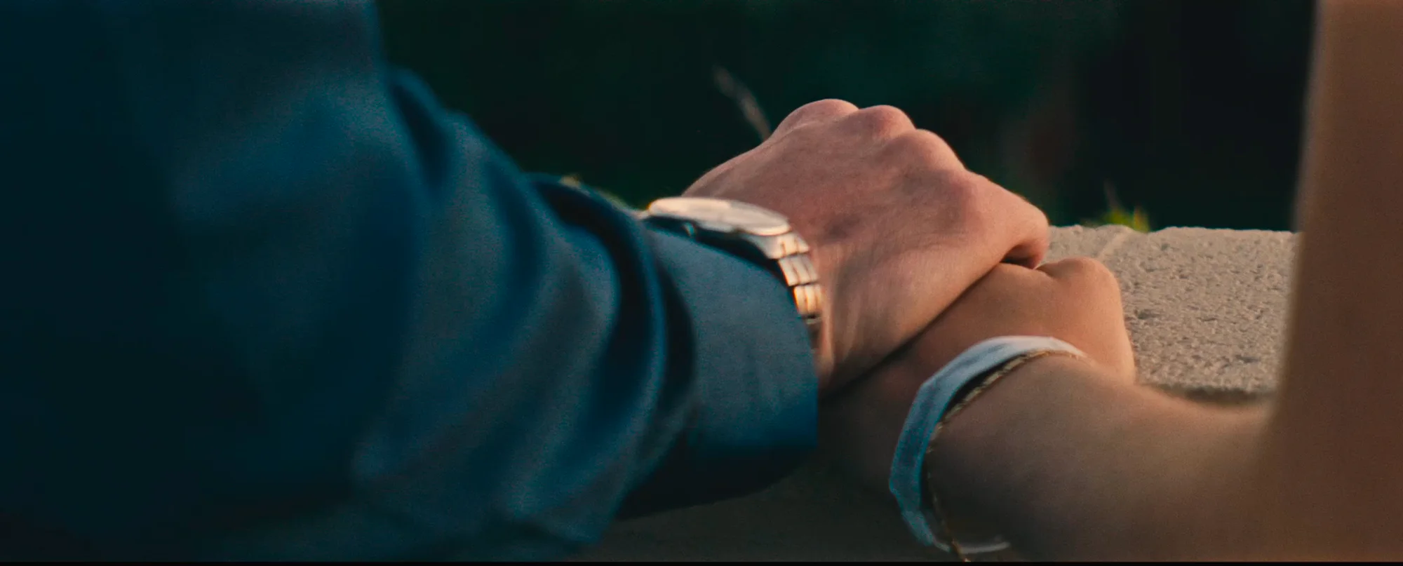 Hands held on a rooftop ledge