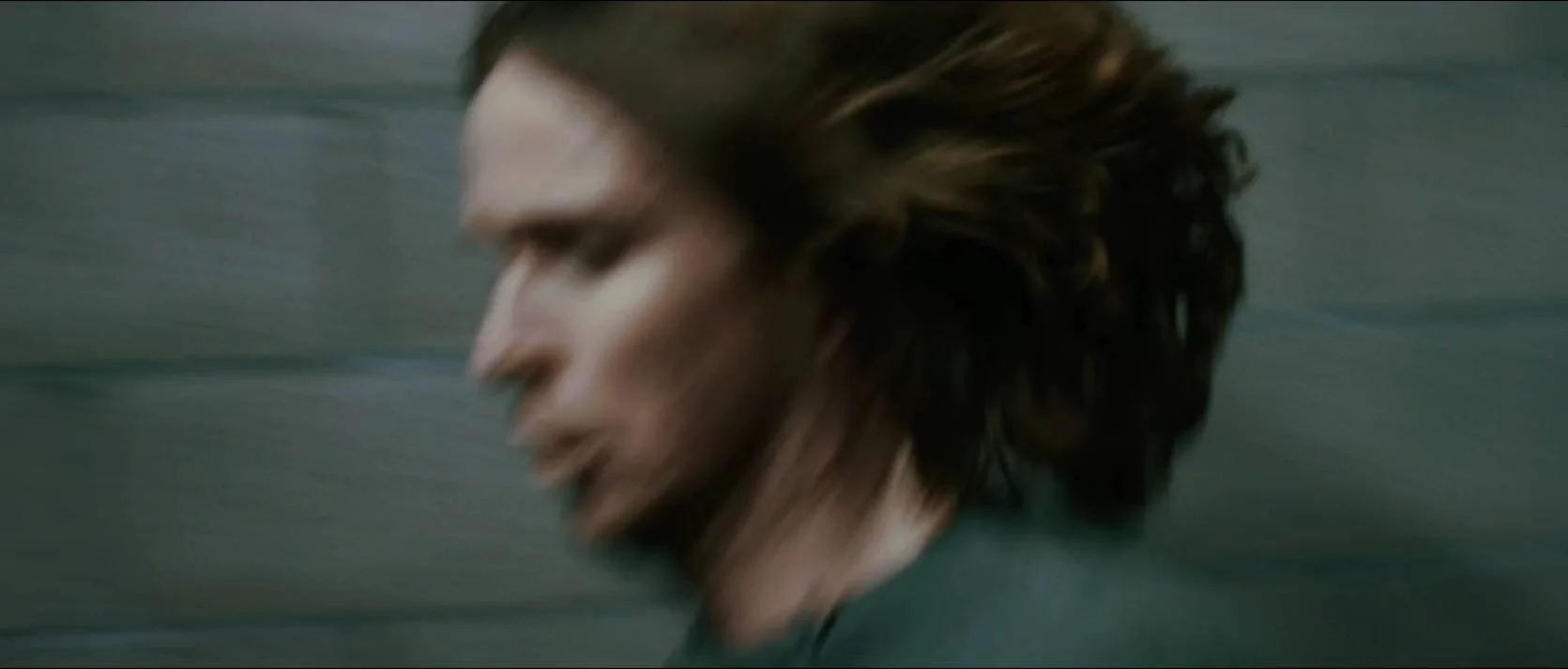A runner rendered as a streak of urban motion